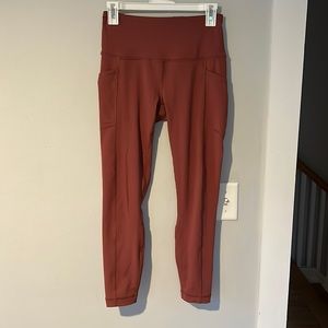 Maroon high waisted workout leggings with side pockets